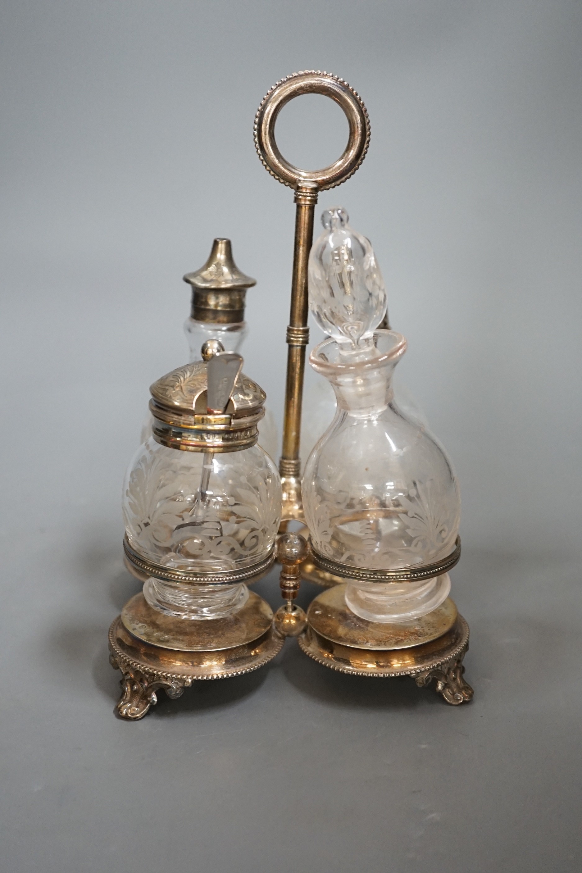 A Victorian silver 4 bottle cruet stand, Hilliard & Thomasson?, Birmingham, 1876, height 20.5cm, with ring handle.